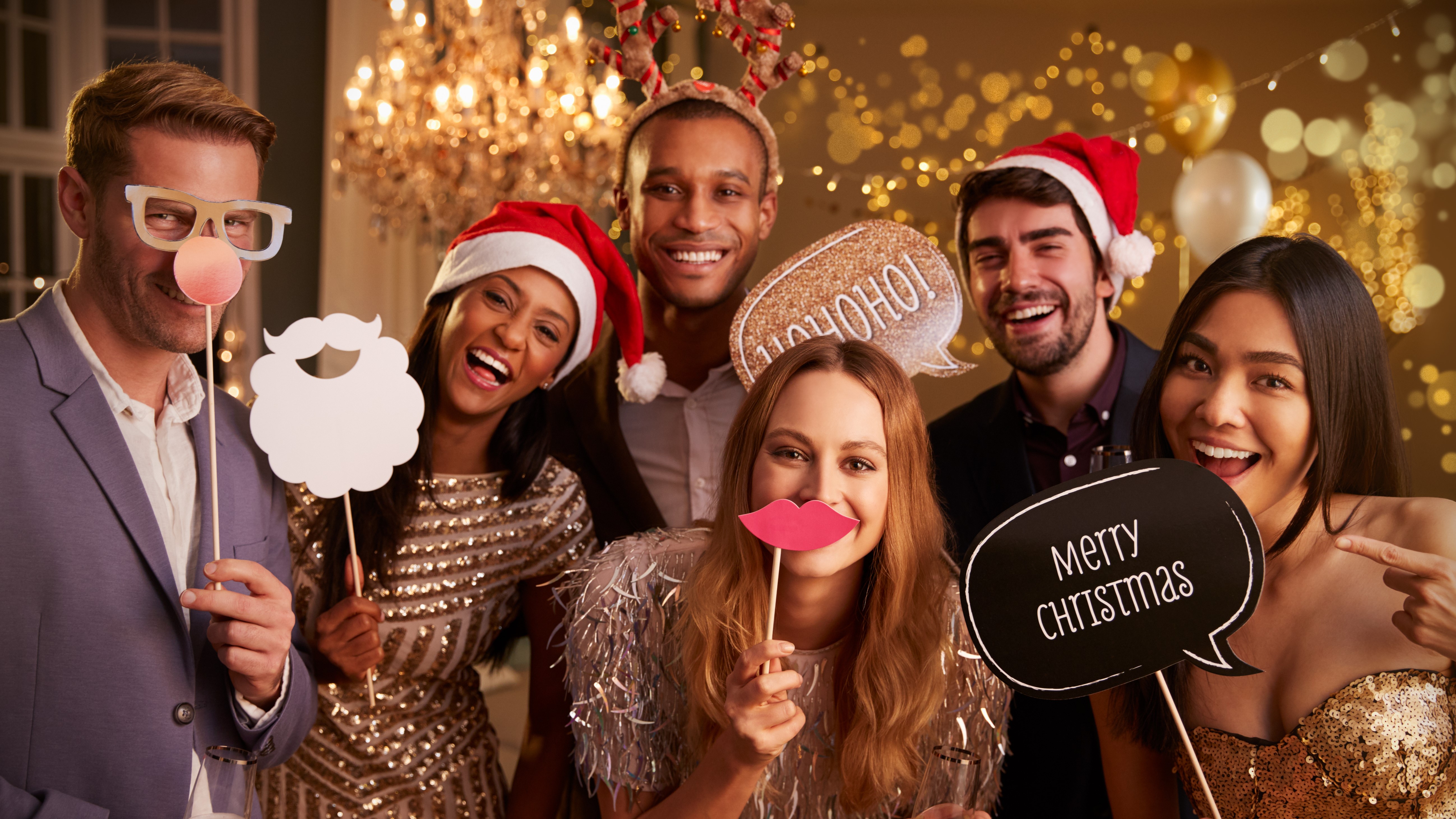 Guests at a Christmas party using a Photo Booth 