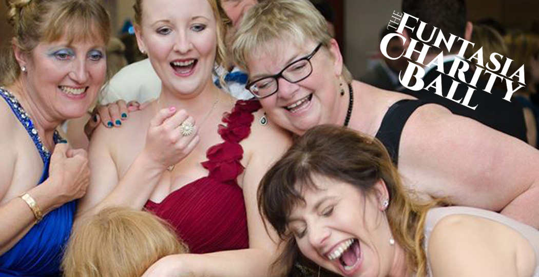 Guests enjoying event entertainment at a charity event